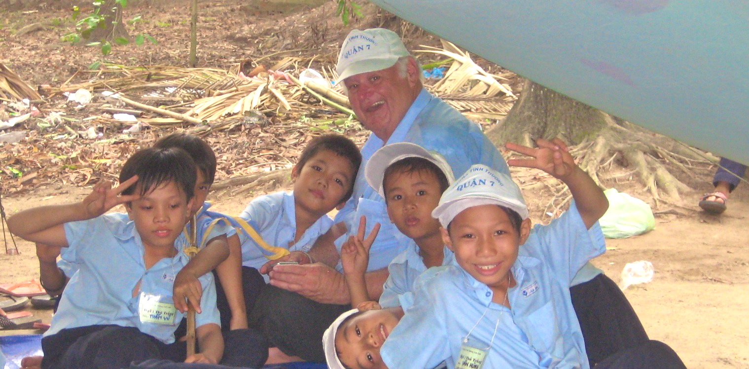 Bridges to Learning Child Sponsor Henry Bechtold with poor young children in Saigon Vietnam. Anh Linh School. 