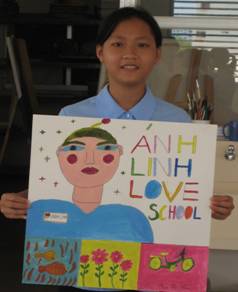 Smiling poor girl holding bright colors artwork. Anh Linh School Saigon Vietnam.