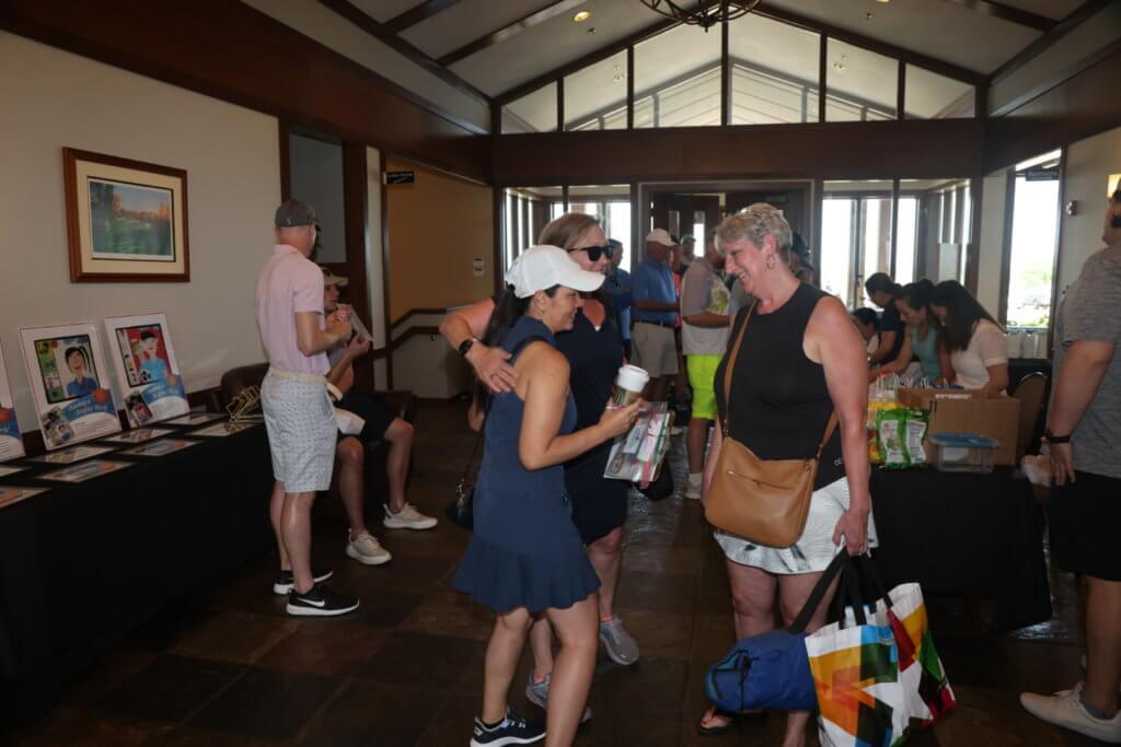 Golfers visit at the 4th Annual Bridges to Learning Golf Tournament at The Wilds Golf Club, Prior Lake Minnesota. Raising funds to educate and care for poor children in Vietnam.