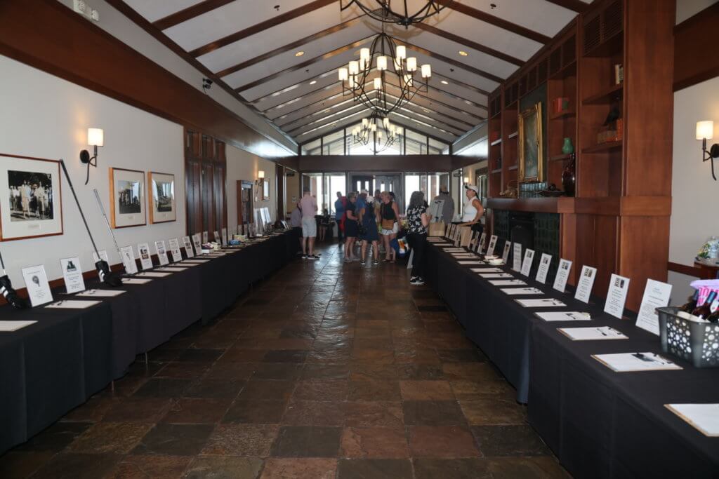 Silent auction items set up at the Wilds Golf Course Clubhouse in Prior Lake Minnesota, for the 4th Annual Bridges to Learning Golf Tournament.