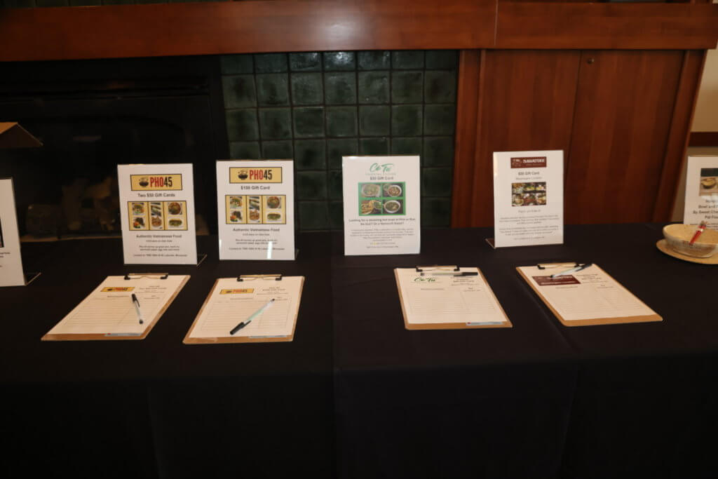 Silent auction items from Pho 45, Co Tu and Sawatdee at the 4th Annual Bridges to Learning Golf Tournament at The Wilds Golf Club, Prior Lake Minnesota. Raising funds to educate and care for poor children in Vietnam.