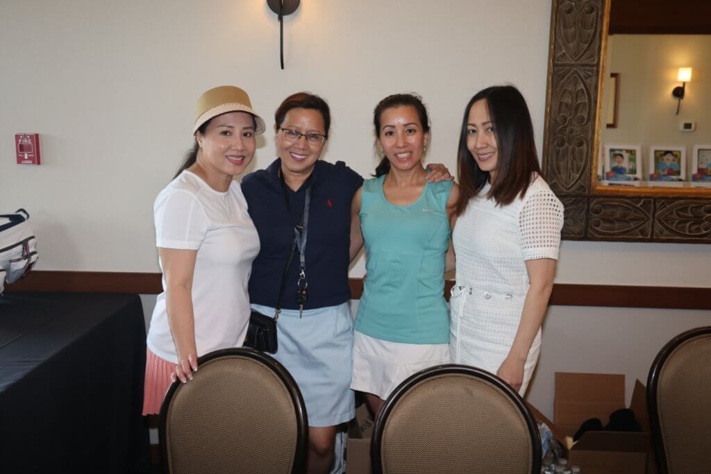 Four volunteers at 4th Annual Bridges to Learning Golf Tournament at The Wilds Golf Club, Prior Lake Minnesota. Raising funds to educate and care for poor children in Vietnam.