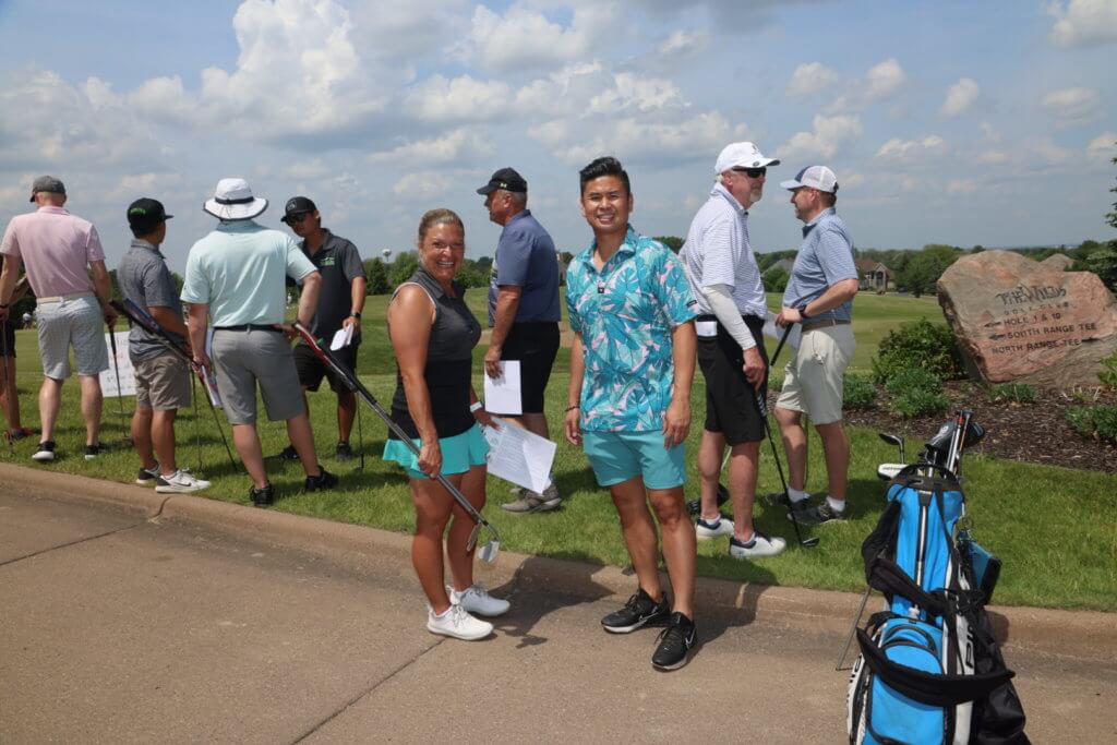 Golfers pose for a picture before heading out to play at the 4th Annual Bridges to Learning Golf Tournament at The Wilds Golf Club, Prior Lake Minnesota. Raising funds to educate and care for poor children in Vietnam.