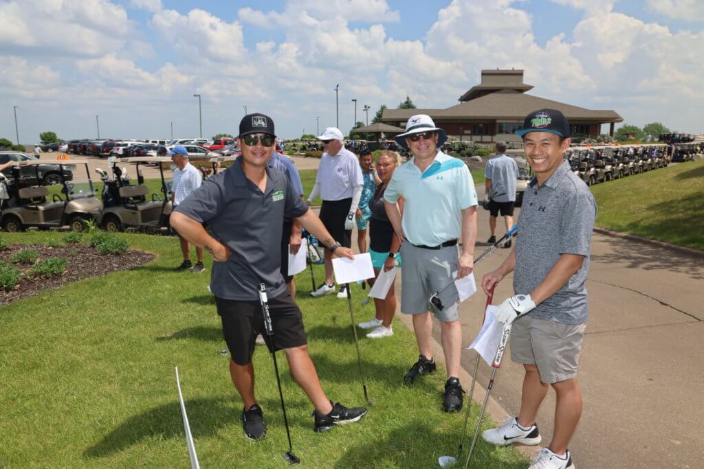 Golfers posing for a photo at the 4th Annual Bridges to Learning Charity Golf Tournament. The Wilds Golf Club. Prior Lake MN.