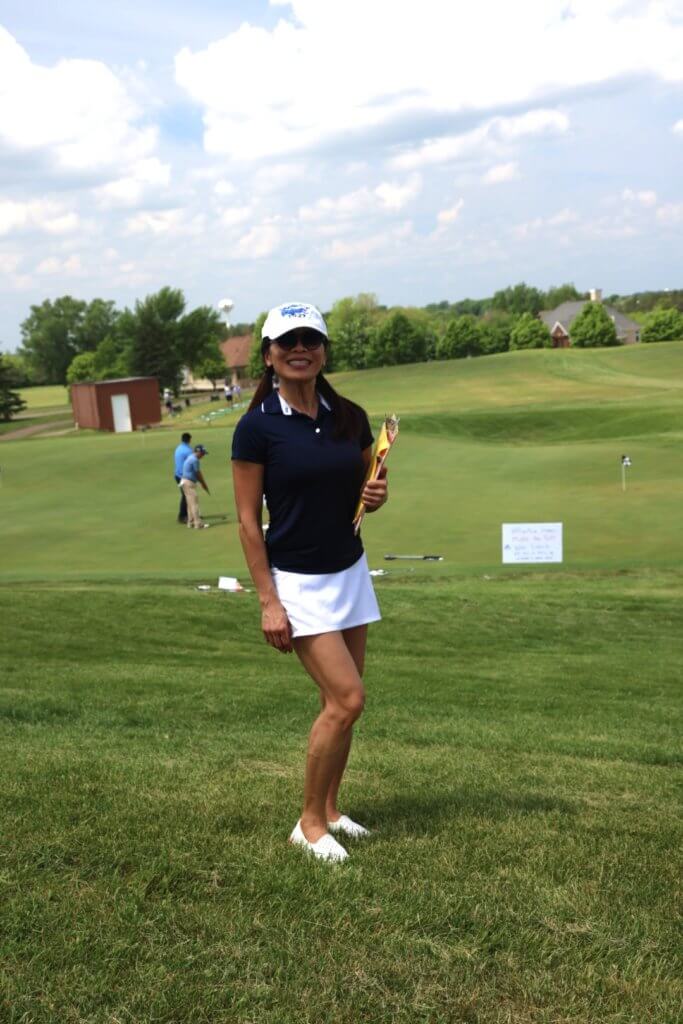 Volunteer leading a game at the 4th Annual Bridges to Learning Golf Tournament at The Wilds Golf Club, Prior Lake Minnesota. Raising funds to educate and care for poor children in Vietnam.