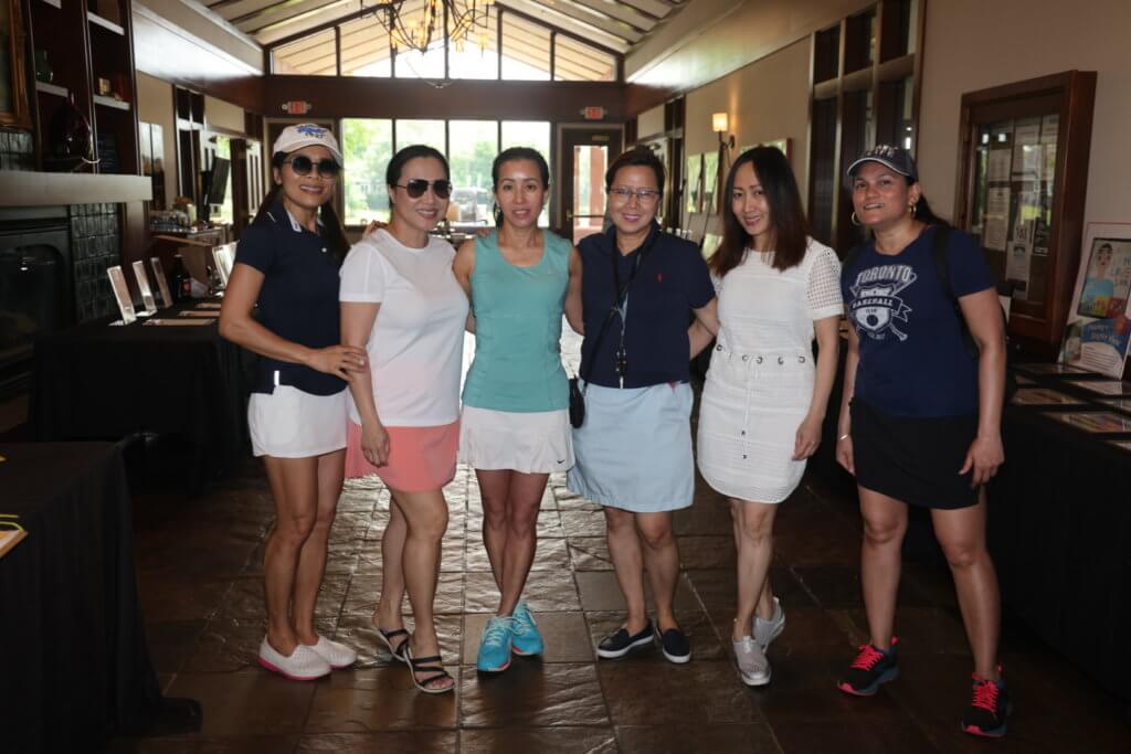 Volunteers posing inside the club for a photo at the 4th Annual Bridges to Learning Charity Golf Tournament. The Wilds Golf Club. Prior Lake MN.