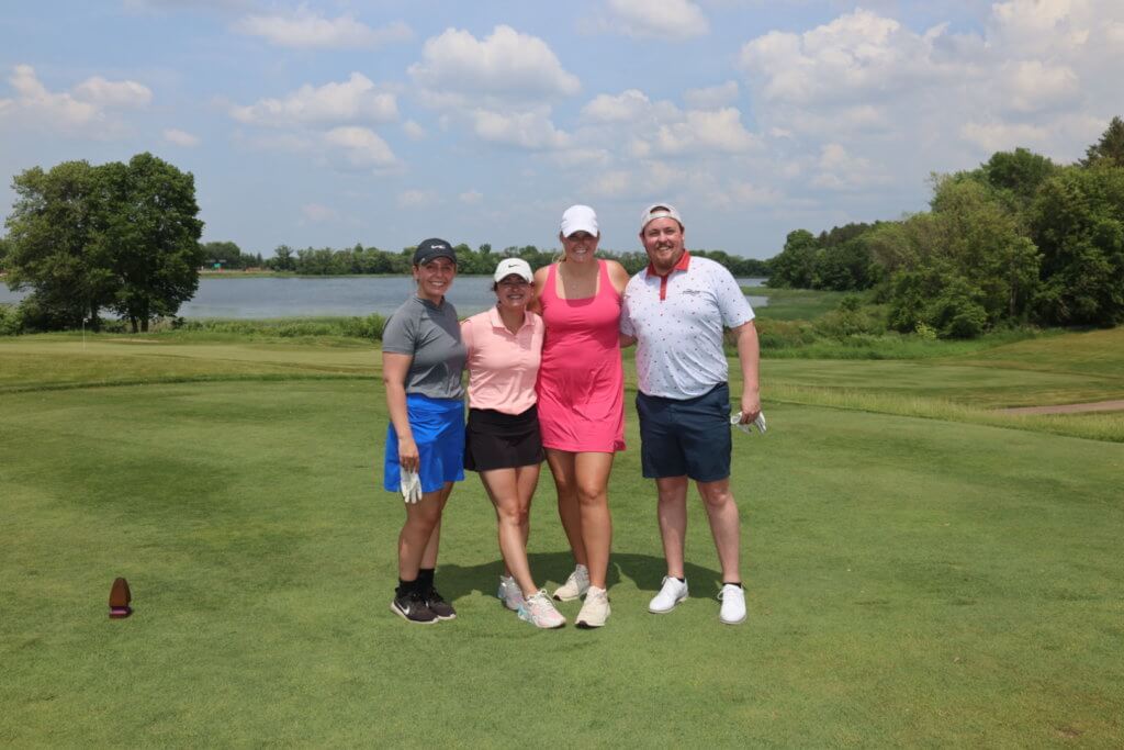 Golfers posing for a photo at the 4th Annual Bridges to Learning Charity Golf Tournament. The Wilds Golf Club. Prior Lake MN. Raising money to education poor children in Vietnam.