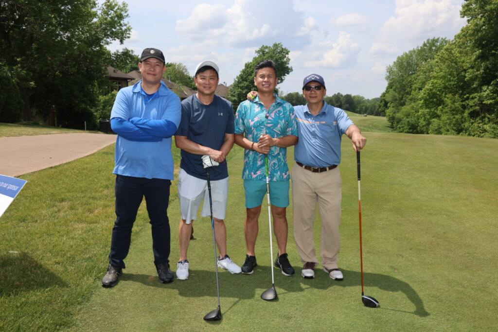 Golfers posing for a photo at the 4th Annual Bridges to Learning Charity Golf Tournament. The Wilds Golf Club. Prior Lake MN. Raising money to educate poor Vietnamese children.
