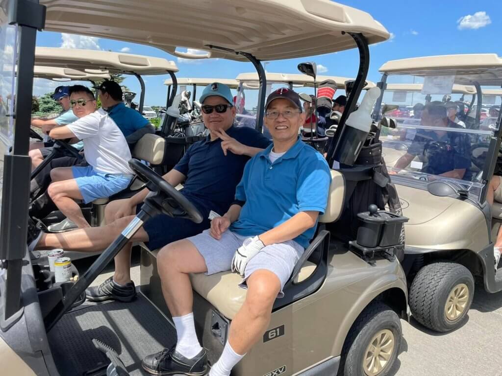Bridges to Learning 3rd Annual Charity Tournament at The Wilds Golf Club, Prior Lake Minnesota. Happy golfers in waiting in golf carts before driving out to play.