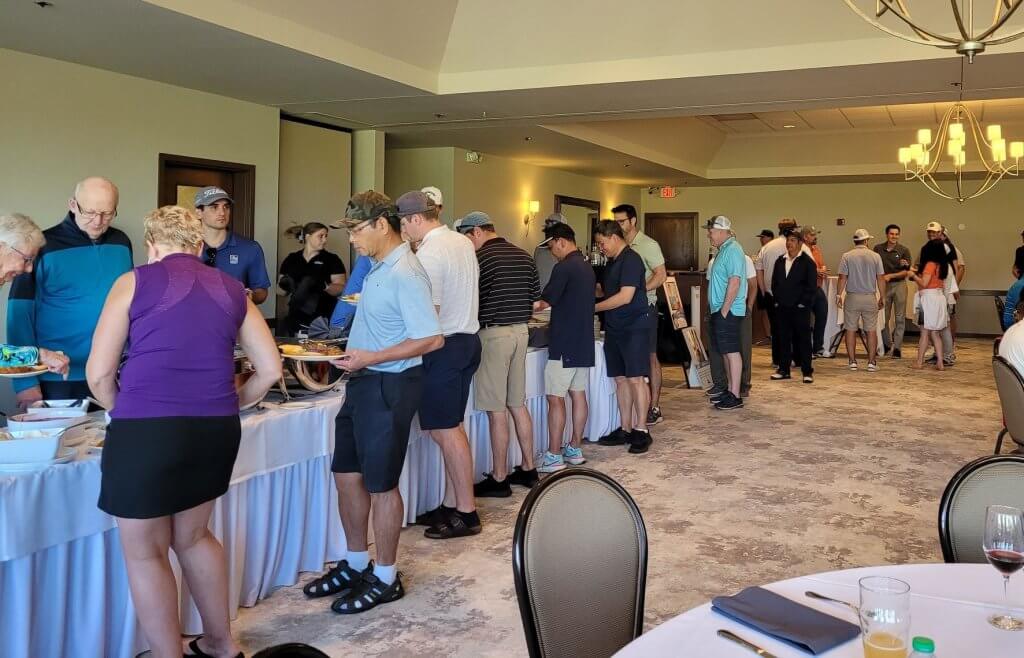 Bridges to Learning 3rd Annual Charity Tournament at The Wilds Golf Club, Prior Lake Minnesota. Golfers lining up at the BBQ buffet.  What a great meal!
