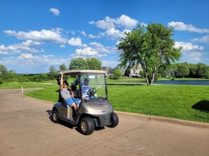 Golfers driving carts on a beautiful day out to the Wilds Golf Course for the 3rd Annual Bridges to Learning Charity Golf Tournament.