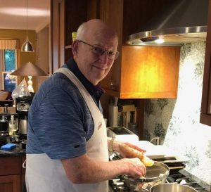Volunteer Bob MacMurdo cooking for Founders Dinner. Bridges to Learning. Minneapolis Minnesota
