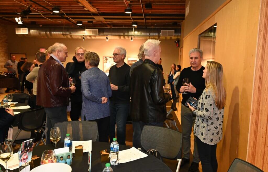 Guests mingle at Bridges to Learning 2022 Wine Tasting. Raising funds to educate impoverished children in Vietnam.