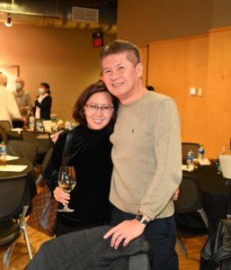 Smiling couple pose at 2022 Wine Tasting. Bridges to Learning nonprofit fundraiser.