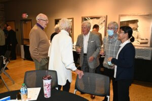 Bridges to Learning founders and former Vietnam school principal visit with guests at 2022 Wine Tasting.