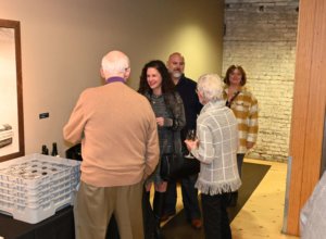 Bridges to Learning founders greet guests at 2022 Wine Tasting. Nonprofit raising funds to educate poor children in Vietnam.