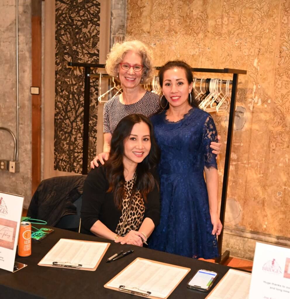 Bridges to Learning volunteers posing for photo. 2022 Wine tasting raising funds to educate poor children in Vietnam.