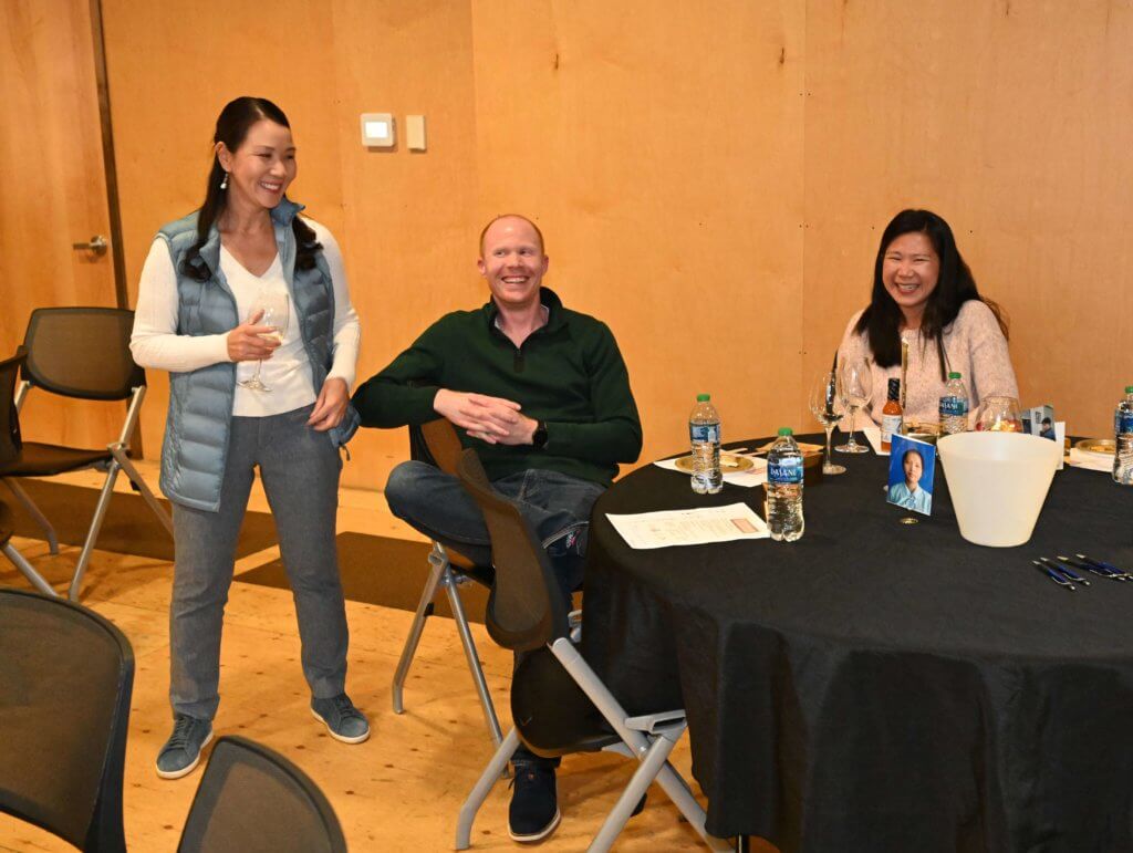 Bridges to learning board members laughing at 2022 Wine Tasting. Raising funds for poor children in Vietnam.