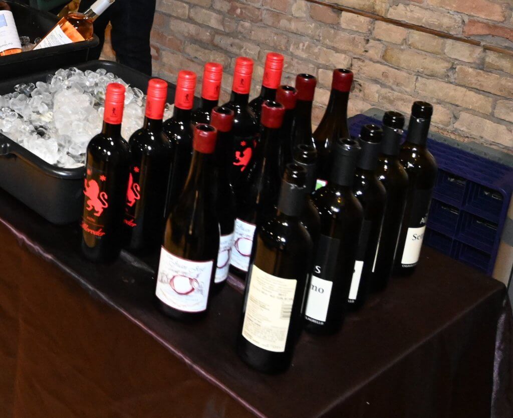 Wine bottles lined up and ready to be served at the 2022 Wine Tasting. Bridges to Learning, Rootstock Wine Co.  and South Lyndale Liquors.  Raising money to educate poor children in Vietnam. Nonprofit.
