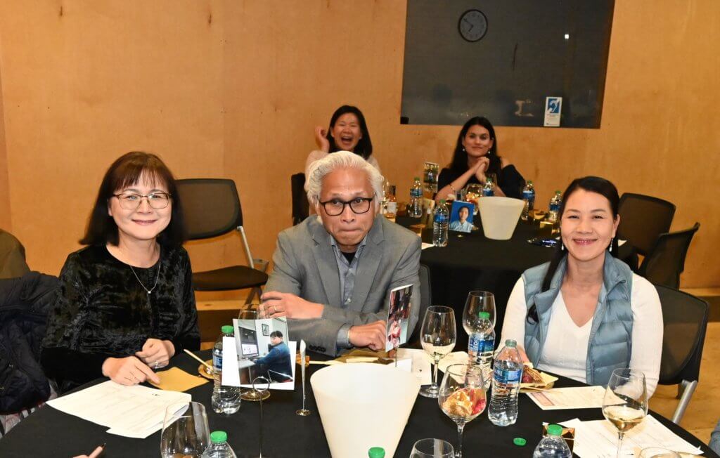 Bridges to Learning board member poses for photo with two guests at the 2022 Wine Tasting. Raising funds and awareness for poor children in Vietnam to provide an education and a better life.
