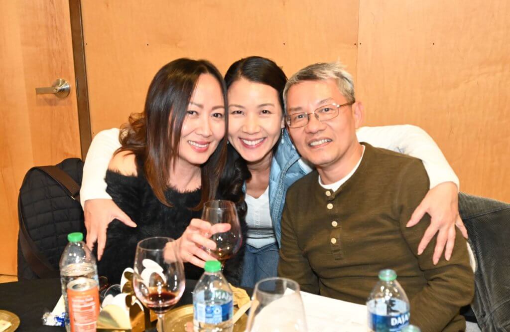 Bridges to Learning board member poses for a photo with supporters of the nonprofit at the 2022 Wine Tasting.