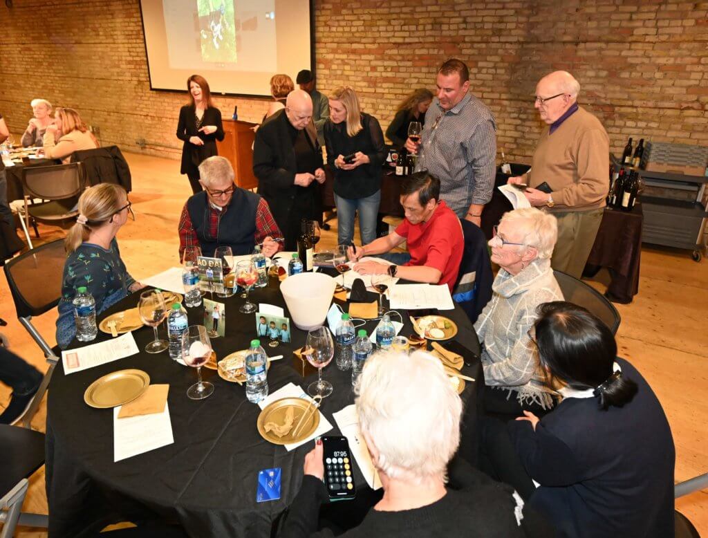 Supporters and volunteers tally up wine orders with South Lyndale LIquors at the Bridges to Learning nonprofit 2022 Wine Tasting fundraiser. Raising money to provide education to poor children in Vietnam.