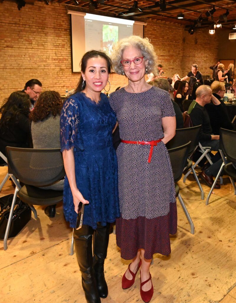 Two Bridges to Learning volunteers pose for a photo at the 2022 Wine Tasting. Nonprofit raising funds to provide education to impoverished Vietnamese children.