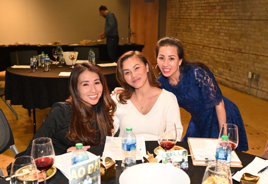 Three 2022 Wine Tasting supporters pose for a photo at the Bridges to Learning nonprofit fundraiser.