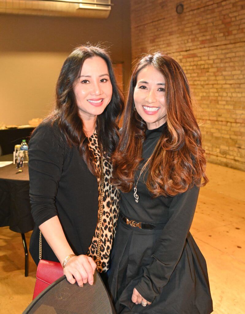 Two 2022 Wine Tasting guests pose for a photo at the Bridges to Learning nonprofit fundraiser.