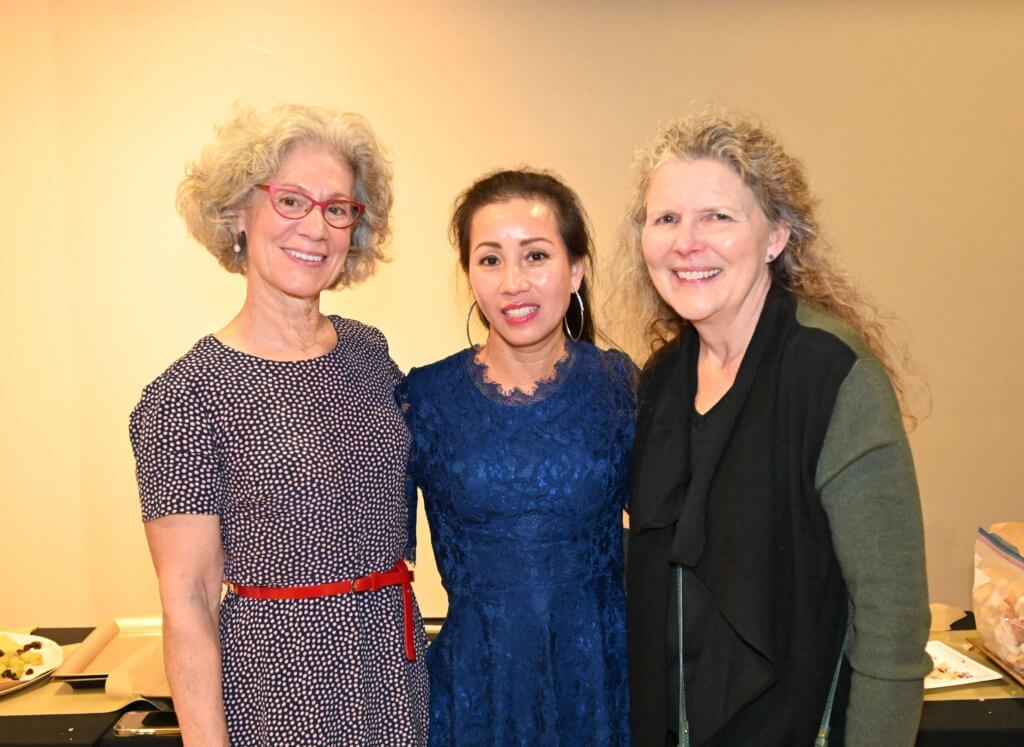 Three Bridges to Learning volunteers pose for a photo at the 2022 Wine Tasting. Nonprofit raising funds to provide education to impoverished Vietnamese children.