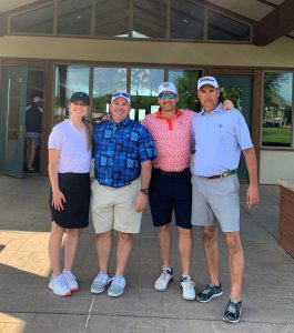 Four golfers smiling for the camera at the 2022 Bridges to Learning Golf Tournament. Raising funds to educate impoverished children in Vietnam.