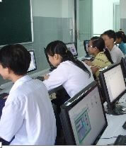 Students studying at computers at Anh Linh school.